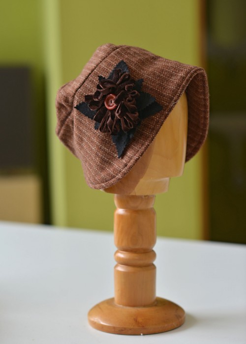 Light brown wool striped cloche hat with flower detail