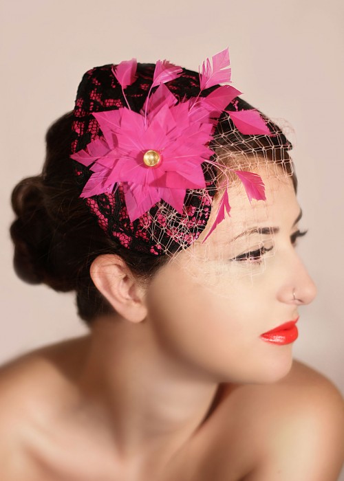 Pink satin fascinator hat with the shape of heart 