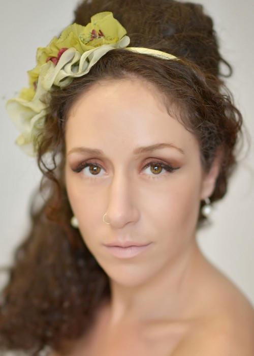 Olive green headpiece with small ruffles mounted on headband