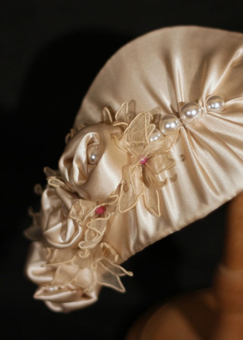 Ivory satin fascinator hat in teardrop shape 