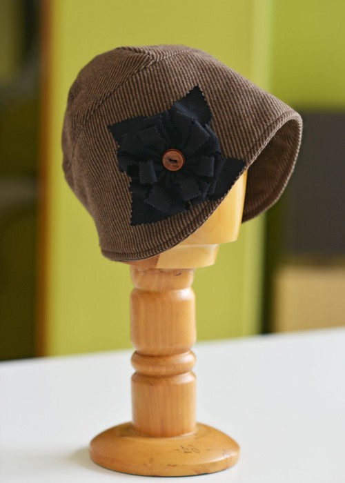 Brown wool striped cloche hat with flower detail