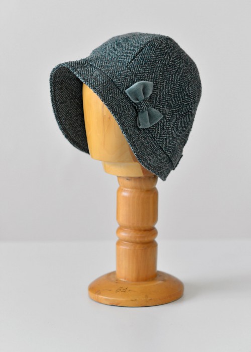 Turquoise wool herringbone cloche hat with a single bow 